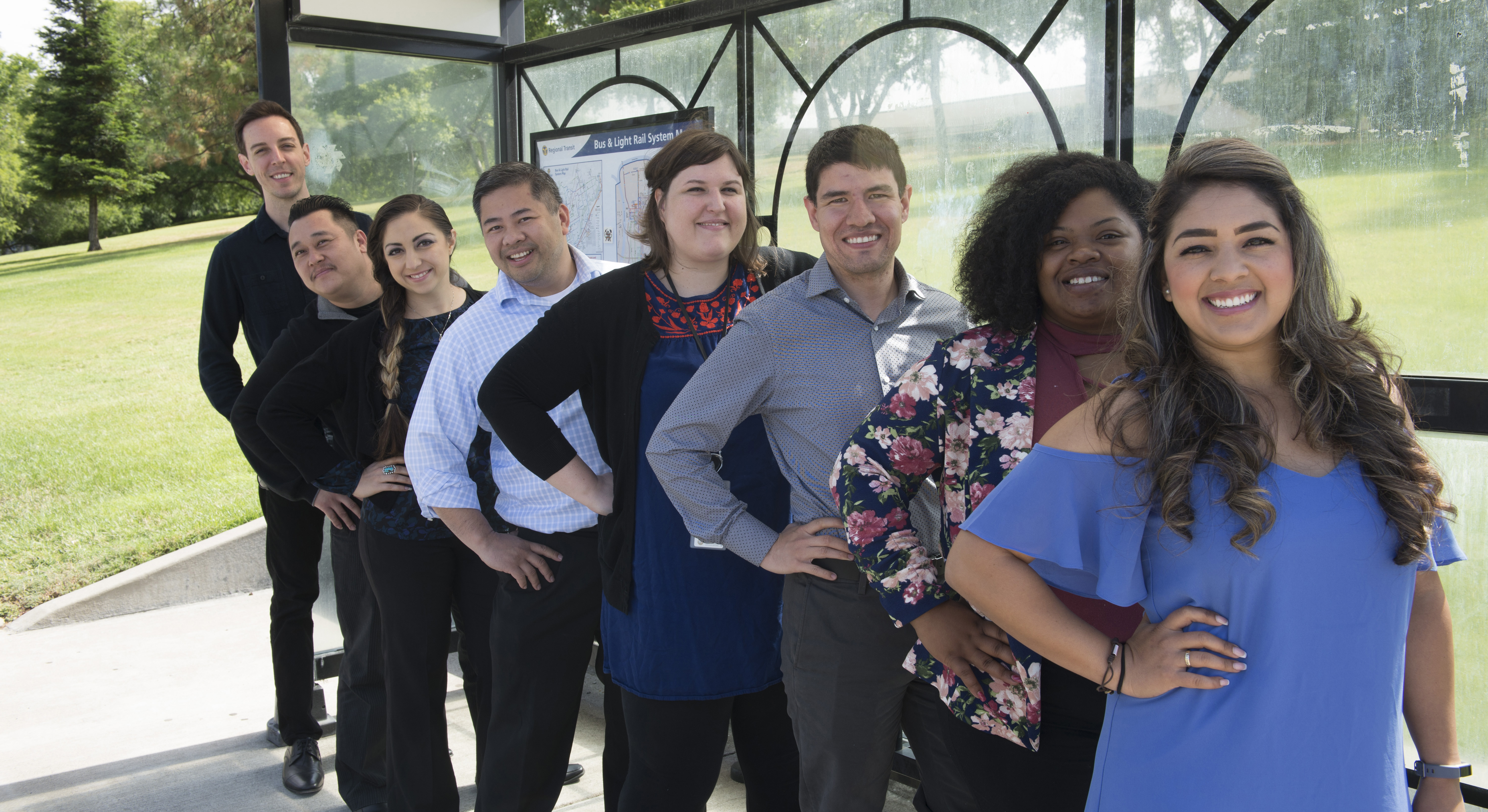 People posing in a line and smiling