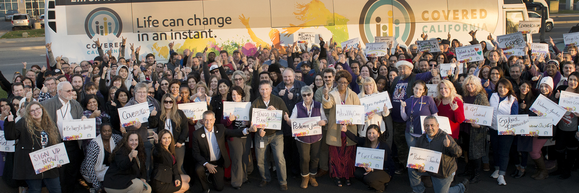 Fresno Group of workers holding a meaningful signs