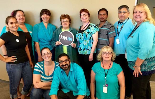 Group of people smiling and posing